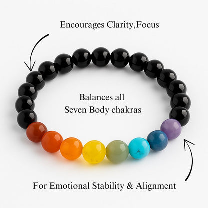 Black beaded bracelet with colored beads representing chakras on a white background