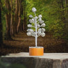 Pyrite tree kept on a stone slab with a frost background